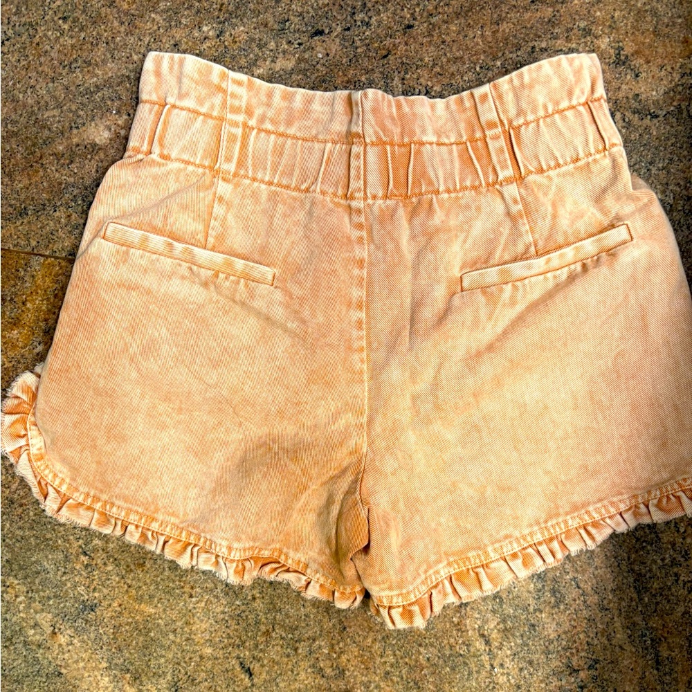 Women’s orange ruffled high waisted shorts in like new condition